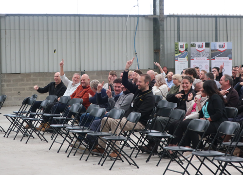Cormac workers raising their hands at interactive safety and wellbeing event
